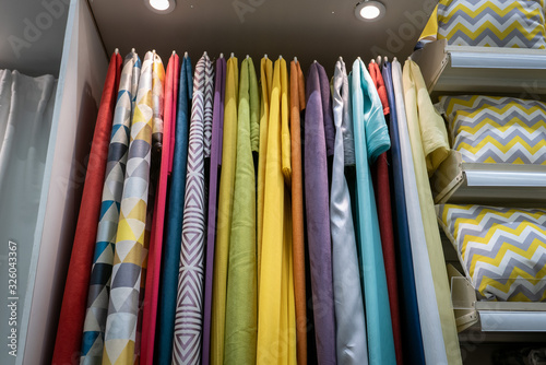 Curtains of different colors and styles in the shop © sharafmaksumov