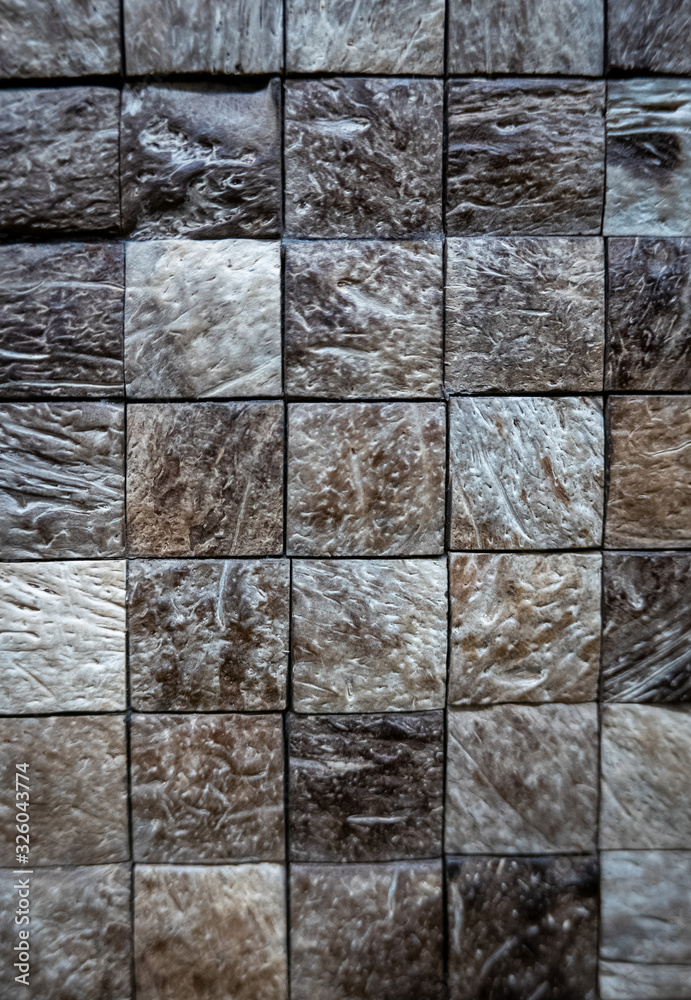 Fototapeta premium Gray ceramic mosaic on the wall as background