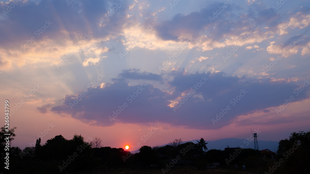 sunset sky horizontal with beautiful puffy fluffy clouds in pink colour light, abstract nature background