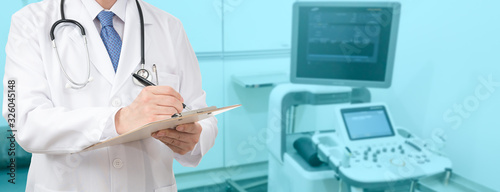 Cropped shot of a male doctor holding a medical chart at the hospital