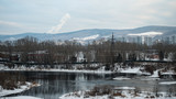 winter cityscape with river and mountain views