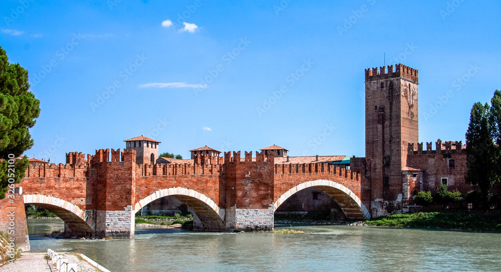 Verona, Veneto / Italy - August 14th, 2009: Castelvecchio Bridge or Scaliger Bridge over the Adige River