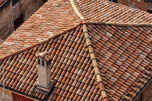 Pantiles. Closeup of an old house roof with tiles made from clay (Coppo in Italian language), seen from above in Bologna city, Emilia-Romagna, Italy, Europe