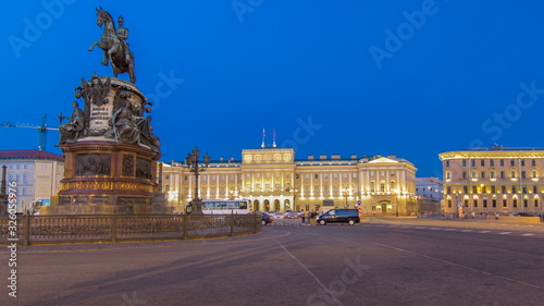 View of the Mariinsky palace and monument to Nikolay I from Isaac's square day to night timelapse . Saint-Petersburg, Russia
