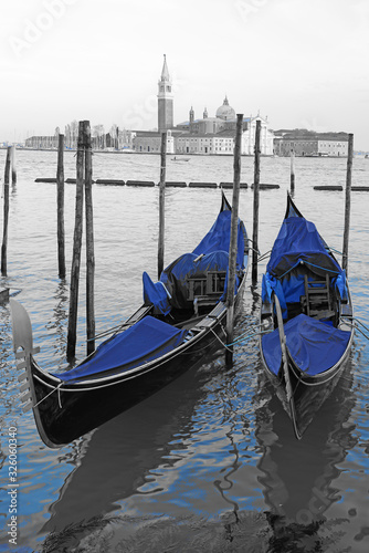 Black and white and blue shot of gondola boats on the Grand Canal in Venice, Italy © eqroy