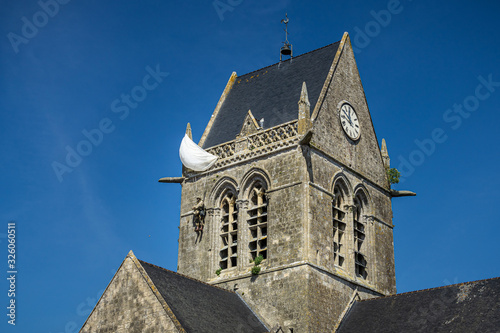 Tablou pe pânză American John Steele paratrooper memorial hanging at the church rooftop ot Sainte-Mère l'Eglise, Normandy, France