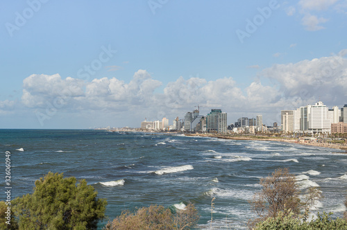 View of the Yafo promenade, high-rise buildings of Tel Aviv on the shore and the Mediterranean coast from the Yafo embankment in old Yafo in Israel