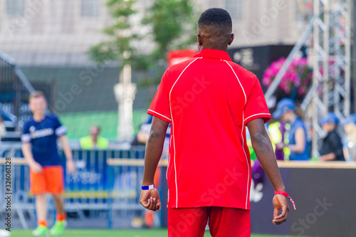 young black soccer player in red uniform