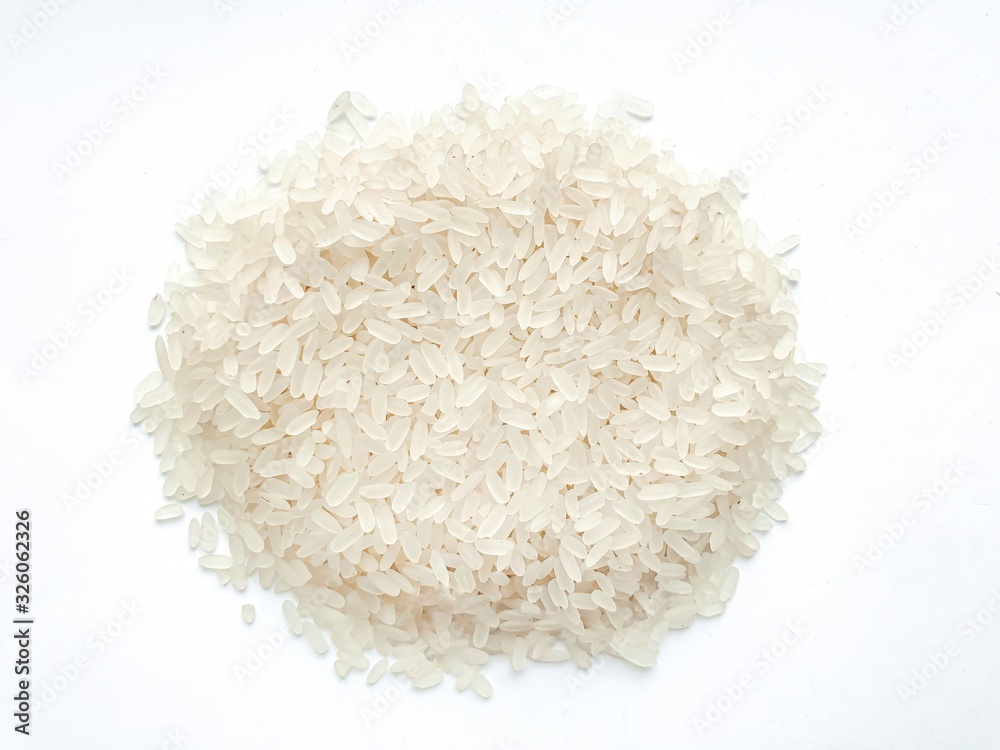 Long grain rice isolated on white background.Concept of healthy eating. Long grain rice isolated on white background.Concept of healthy eating.