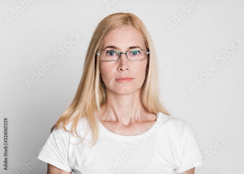 Close-up of beautiful middle aged woman looking at camera