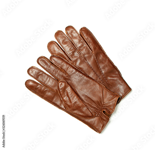 Brown classic leather men's gloves on white isolated background top view. Stylish Fashionable winter autumn spring clothing accessory. Genuine leather gloves