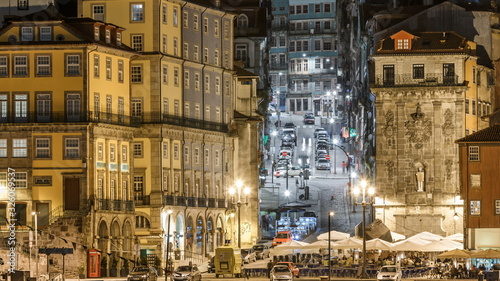 traditional quaint houses in the old  vintage and touristic ribeira district of Porto at night timelapse  Portugal