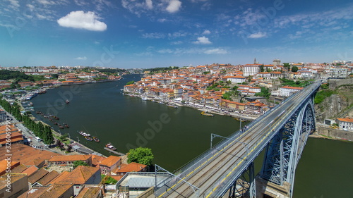 View of the historic city of Porto, Portugal with the Dom Luiz bridge timelapse. A metro train can be seen on the bridge
