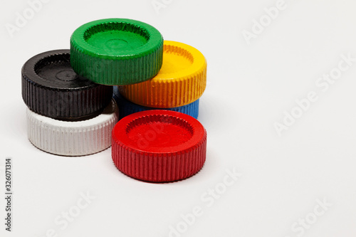 playing chips in different colors on white background