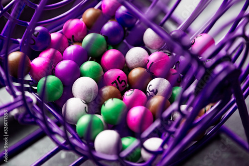 purple lottery game in close-up with different colored balls with numbers
