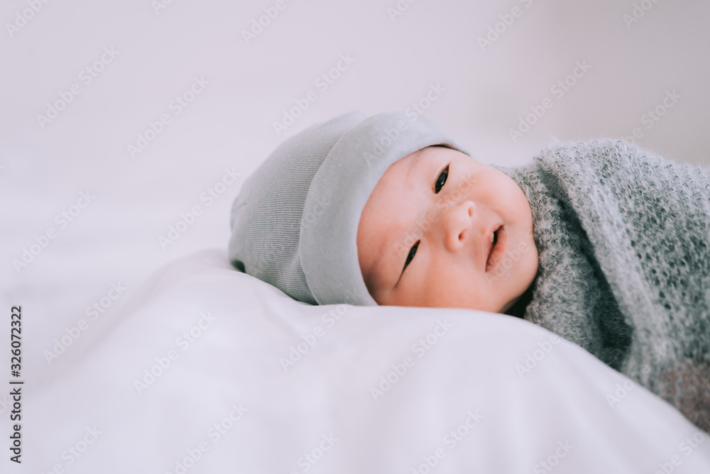 Smiling baby boy lying on a white bed, Family morning at home,Children hygiene. Smiling baby boy lying on a white bed, Family morning at home,Children hygiene.