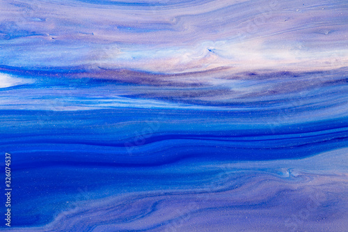 Fluid art texture. Abstract backdrop with mixing paint effect. Liquid acrylic artwork with beautiful mixed paints. Can be used for interior poster. Blue, blue and white overflowing colors.