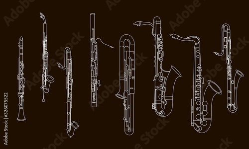 White outline various musical instruments, the contour of clarinets, oboe, saxophones, bassoon and contrabassoon on a black background