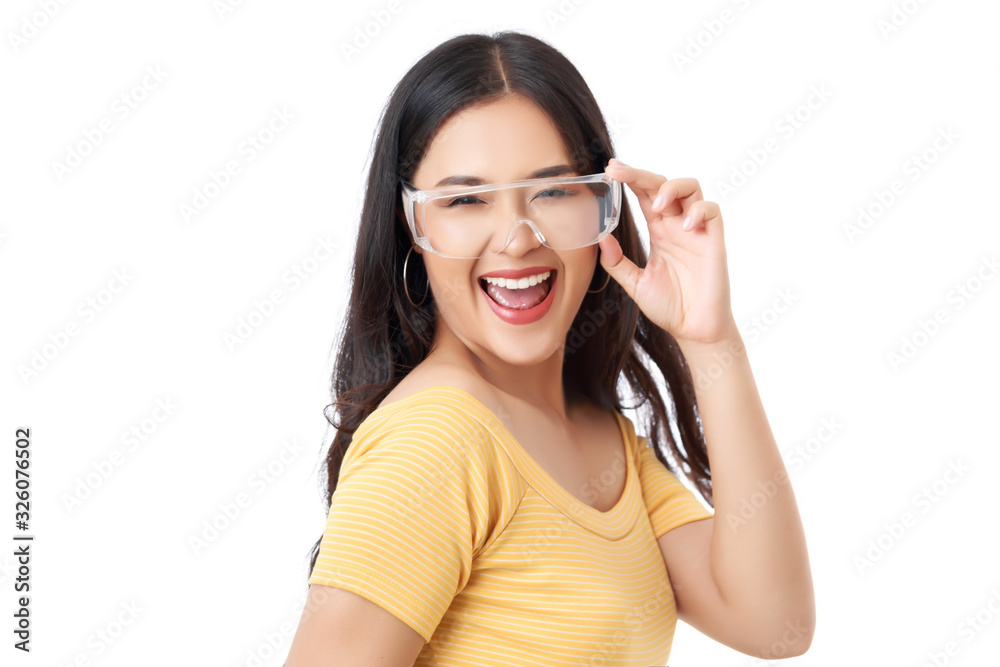 Young attractive Asian woman with healthy skin wearing yellow t-shirt holding glasses isolated on white background. Young attractive Asian woman with healthy skin wearing yellow t-shirt holding glasses isolated on white background.