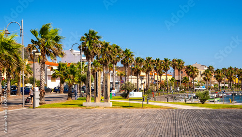 Golfo Aranci, Sardinia, Italy - Panoramic view of Golfo Aranci yacht port - Marina di Golfo Aranci - with seashore park boulevard at the Tyrrhenian Sea coast photo