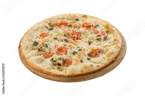 Delicious seafood pizza with salmon, capers and tomatoes on wooden board isolated on white background