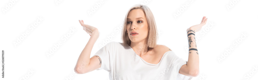 confused young tattooed girl showing shrug gesture isolated on white, panoramic shot confused young tattooed girl showing shrug gesture isolated on white, panoramic shot