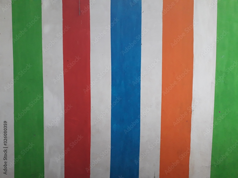 Various colorful vertical lines on the white wall. Great for background, wallpaper and more. Various colorful vertical lines on the white wall. Great for background, wallpaper and more.