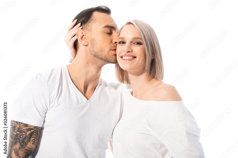 happy young tattooed couple hugging and kissing isolated on white happy young tattooed couple hugging and kissing isolated on white