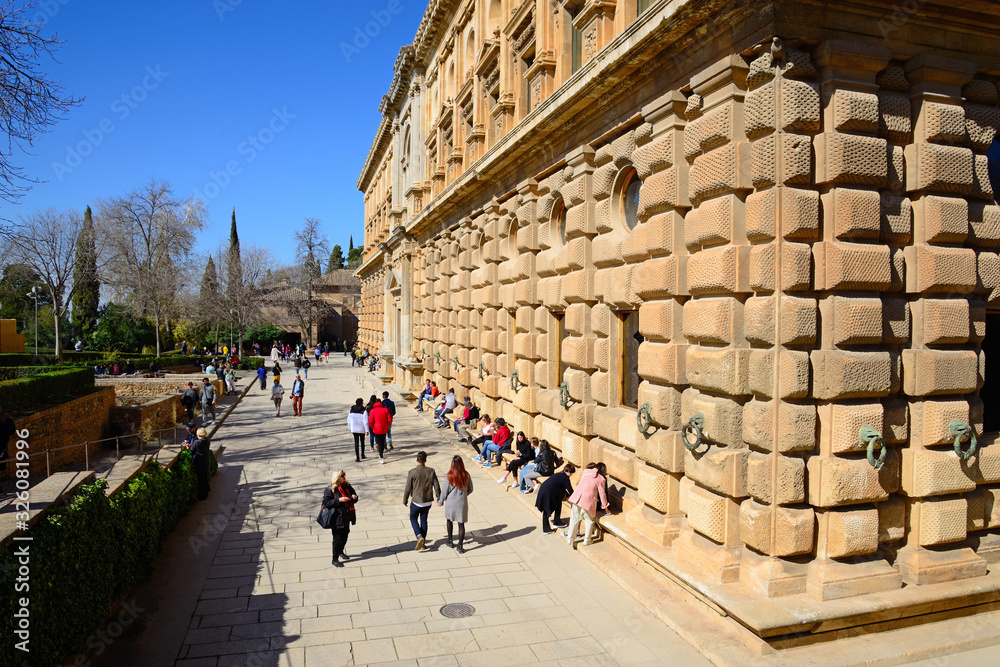 Granada, Spain - February 20, 2020: Exterior facade of the Palace of Carlos V in the Alhambra in Granada.