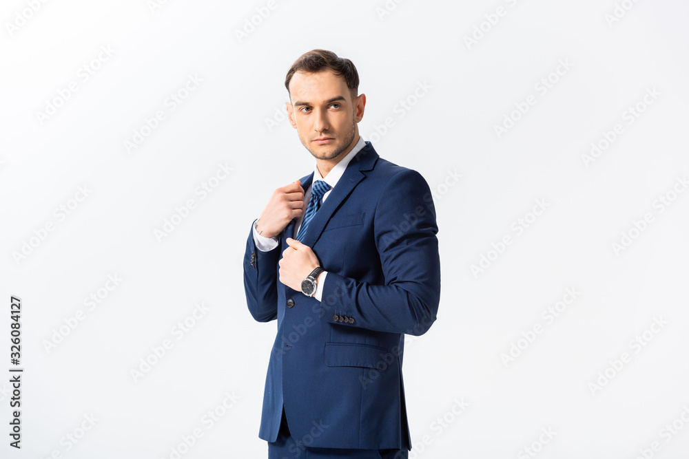 successful young businessman in blue suit looking away isolated on white successful young businessman in blue suit looking away isolated on white