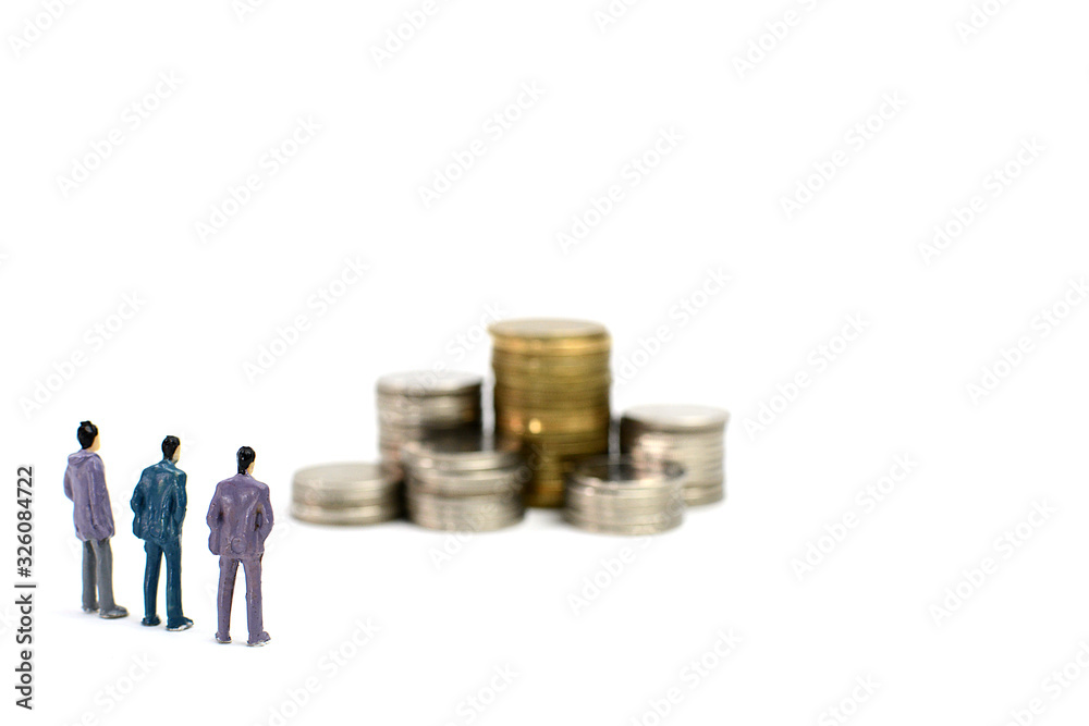 Miniature figures businessman on coins, on the white backgroud.