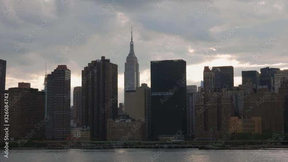 Evening view of Manhattan with Empire State Building. Sunset in NYC. Evening view of Manhattan with Empire State Building. Sunset in NYC.