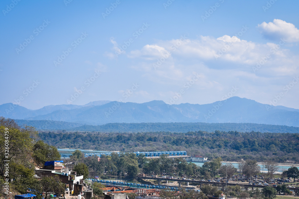 landscape with river and mountain, and blue sky looks very beautiful, in Haridwar  Uttarakhand 