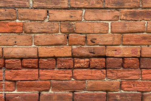 old vintage red orange brick wall close-up detailed
