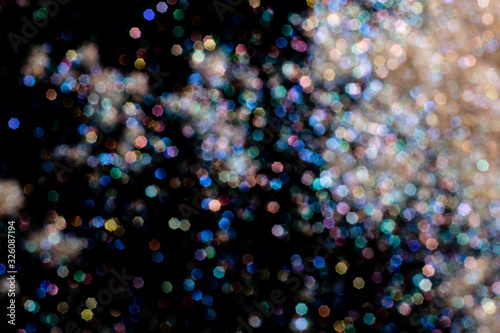 bokeh multicolored glitter lights background colorful lens effect, copy space.