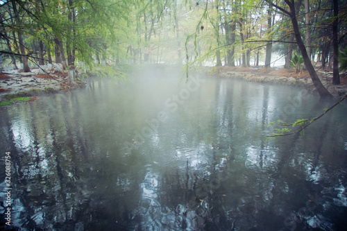 Hot Spring  Blurred photo of morning fog over a lake in cold autumn weather in half moon san luis potosi