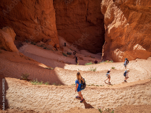 Young woman travels Bryce Canyon national park in Utah, United States, people travel explore nature. Bryce is a collection of giant natural amphitheaters distinctive due Hoodoos geological structures photo