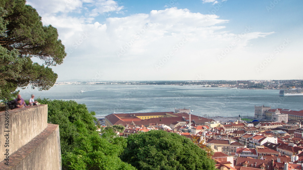 View of the historical Lisbon Baixa downtown and Tagus River, from the Sao Jorge St. George Castle in Lisbon, Portugal timelapse