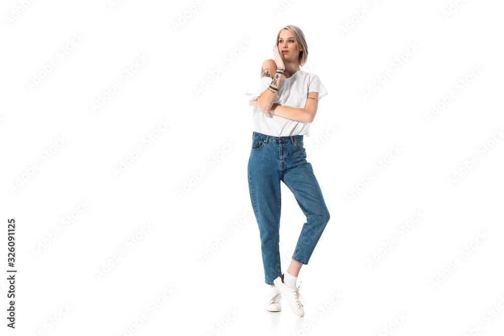 pensive young tattooed girl looking away isolated on white pensive young tattooed girl looking away isolated on white