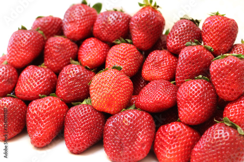 lots of strawberries on a white background