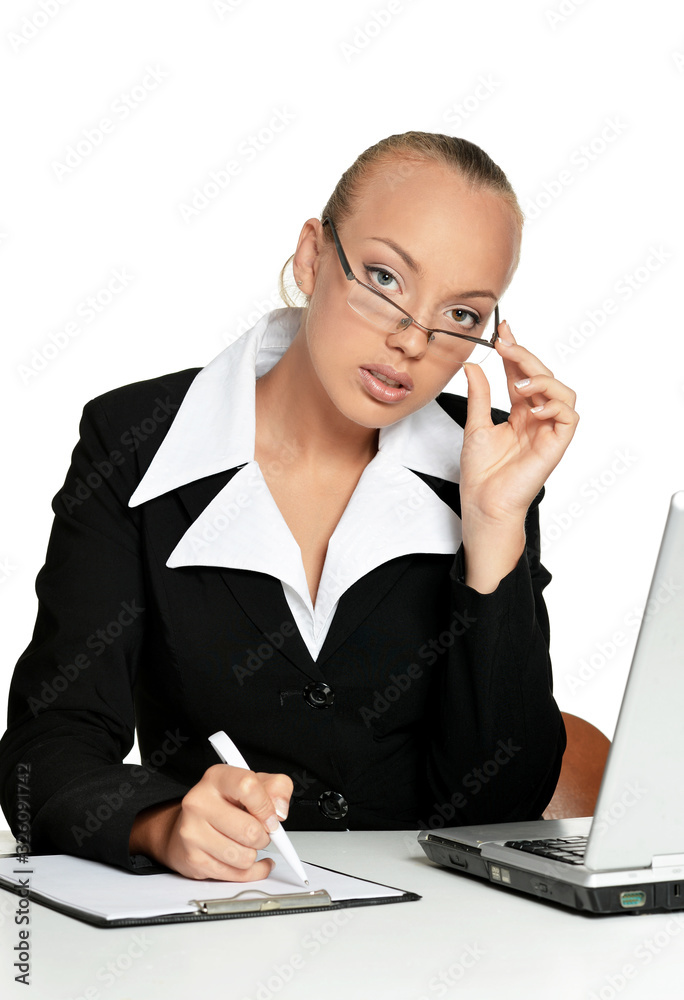 Young secretary sitting at table with laptop Young secretary sitting at table with laptop