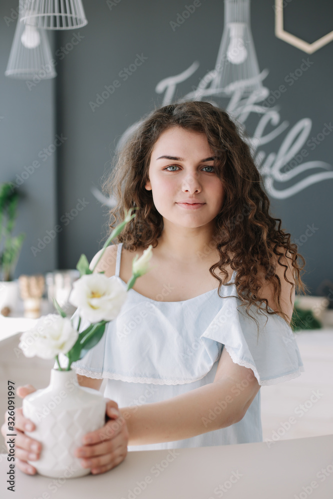 Portrait of a beautiful girl. Romantic shot. Young pretty happy woman in a dress. Fashion style photo of a smiling girl Portrait of a beautiful girl. Romantic shot. Young pretty happy woman in a dress. Fashion style photo of a smiling girl
