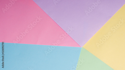 background of blue, yellow, pink, lilac sheets of paper