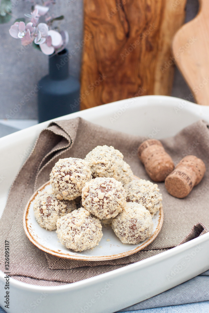 Delicious milk chocolate and peanut butter truffles dipped in chopped peanuts Delicious milk chocolate and peanut butter truffles dipped in chopped peanuts