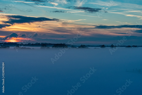 Sonnenuntergang im Nebel in Hangelar Flugplatz