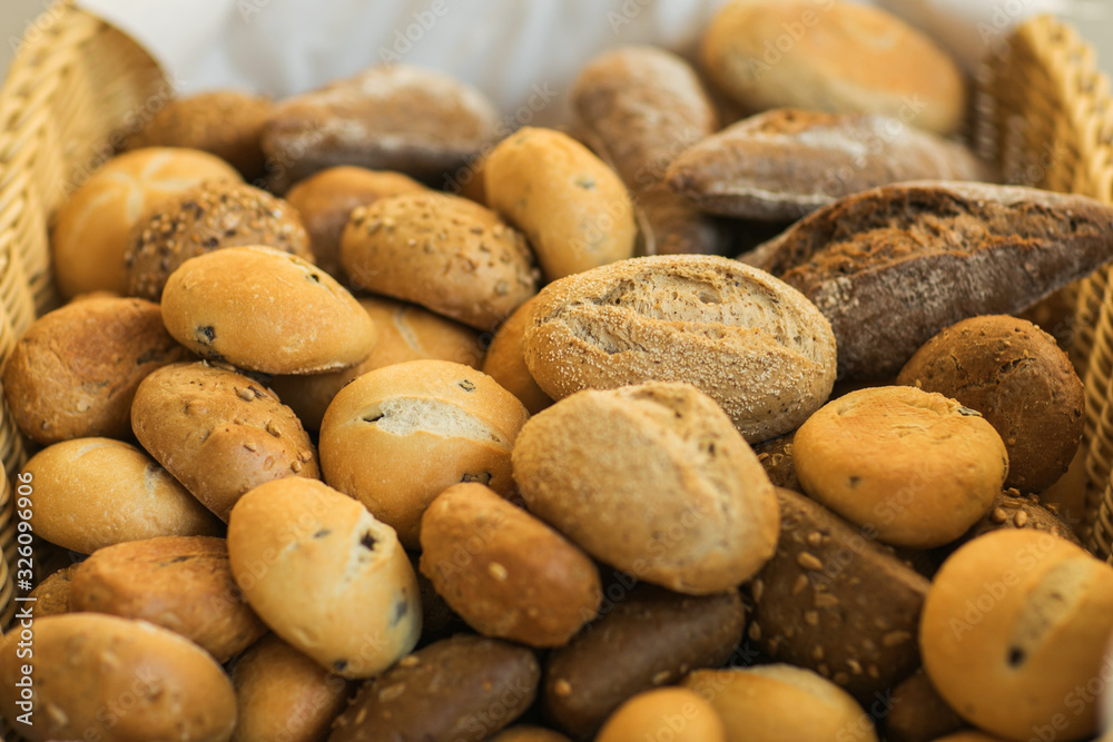 Fresh homemade bread rolls in little basket Fresh homemade bread rolls in little basket