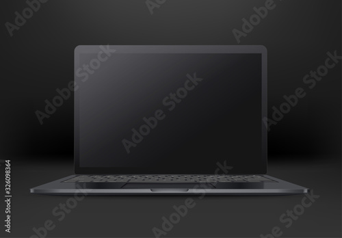 Black laptop with empty screen on black background. Mock up for a design