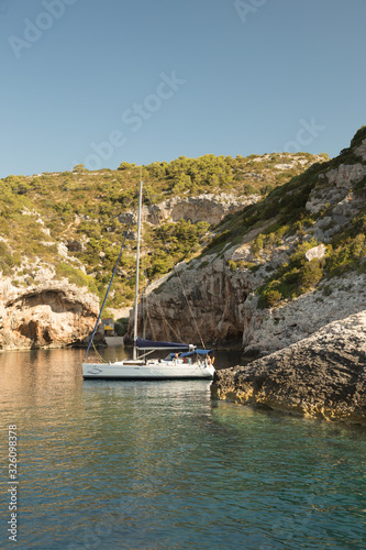 Yacht mooring in Stiniva bay, island Vis, Croatia photo