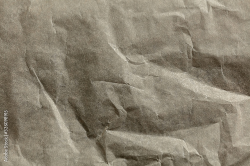 Close up shot of surface of crumpled paper texture for background or devices wallpapers. Abstract design, usual, natural materials. Detailed grungy artwork. Copyspace, advertisement. Vintage style.