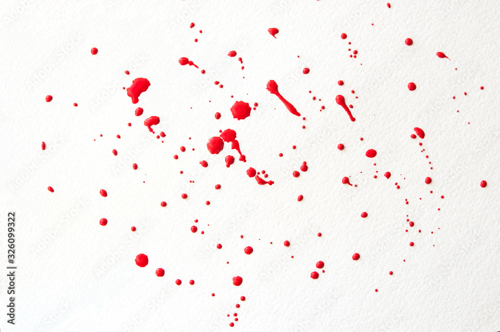 drops of red paint on a white background